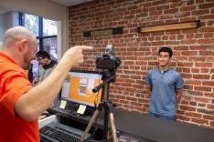 student having his ID card picture taken